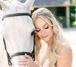 woman wearing christie lauren single vine headpiece beside horse