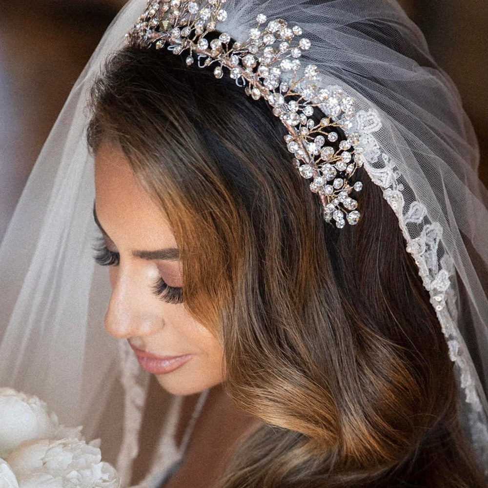 
                      
                        bride wearing half renni stone bridal headpiece by christie lauren
                      
                    